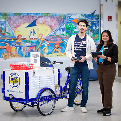 University at Buffalo career staff helping students at a hiring pop-up